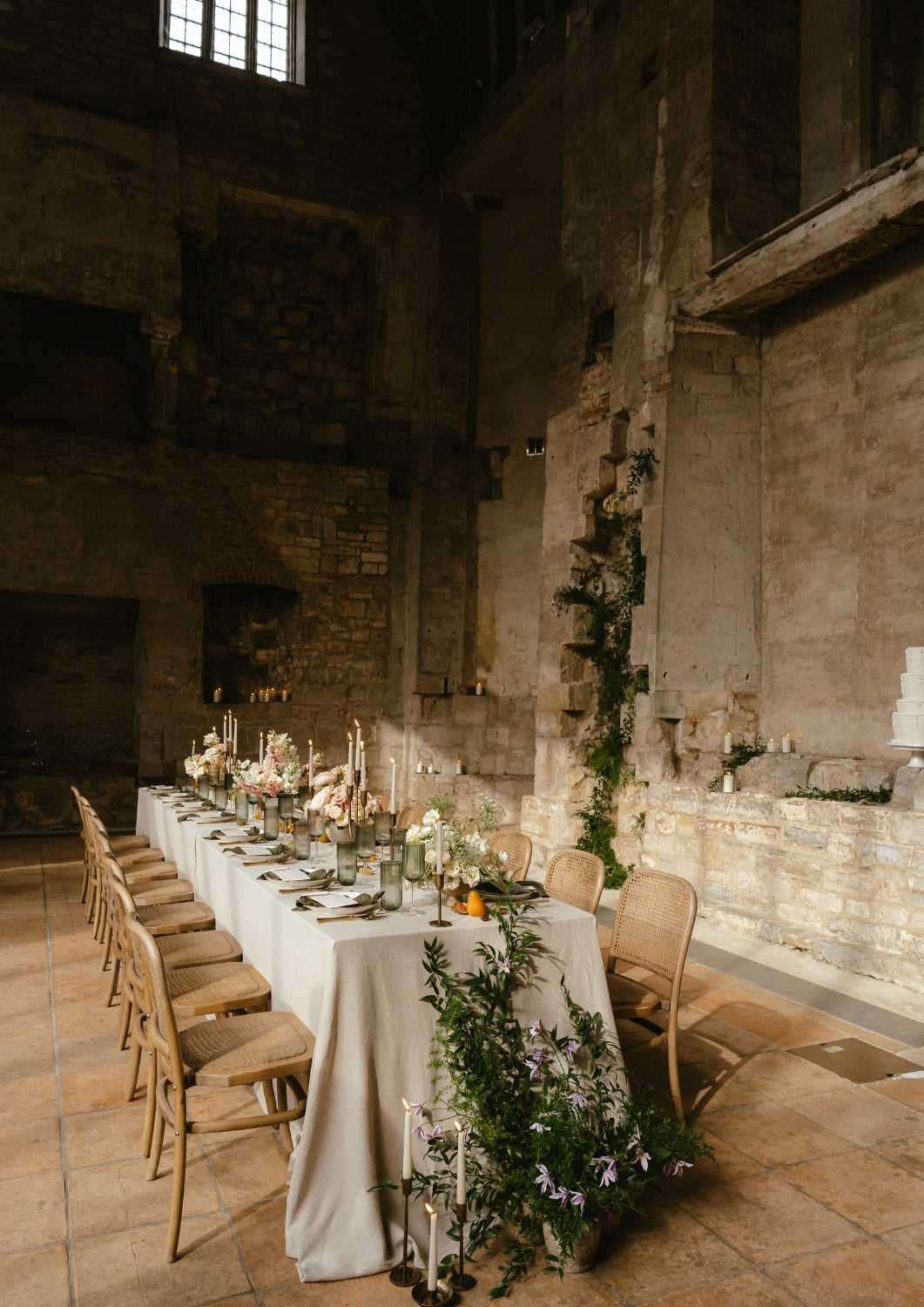 What a Host Home: Modern Wedding tablescape with gold cutlery, round porcelain plates and gold rustic iron candle hodlers