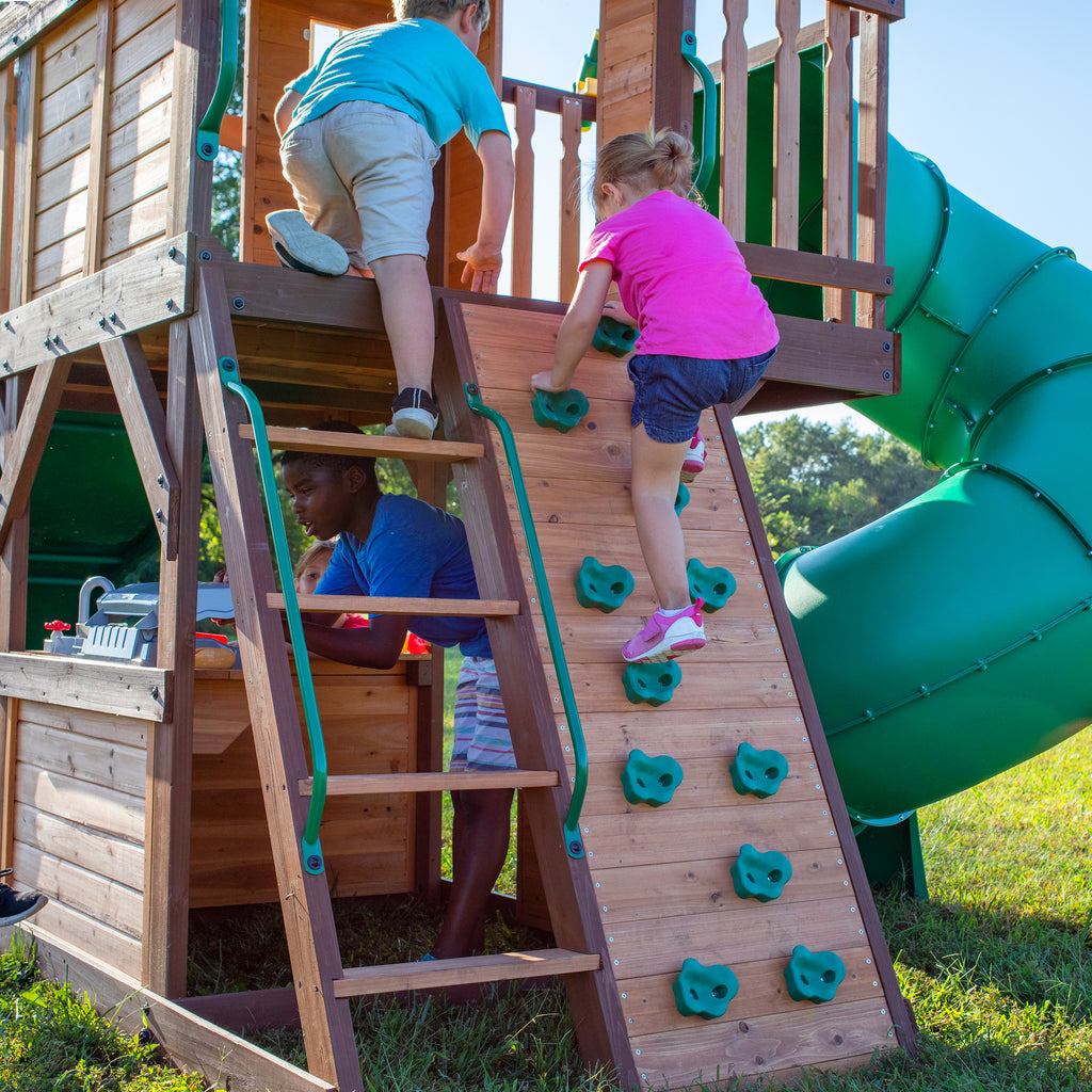 backyard playsets with rock wall