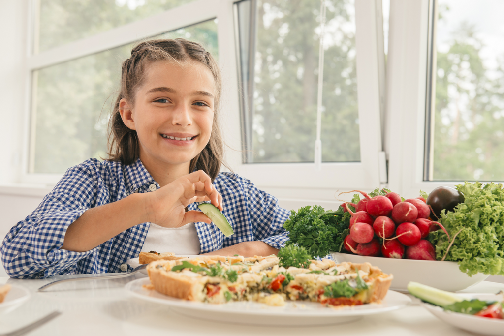 young girl eating healthy foods