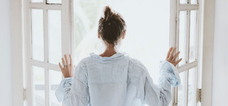 girl opening window