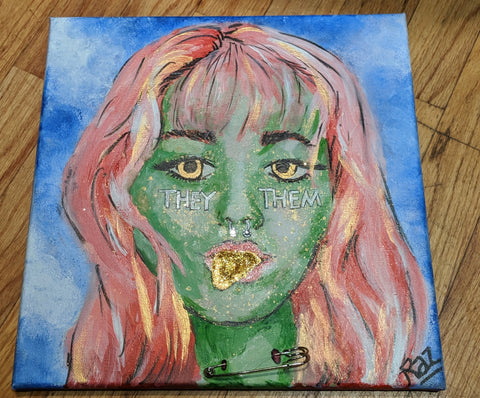 Mystic portrait with green skin and pink hair with mixed media elements of glitter, jewels, and a safty pin. 