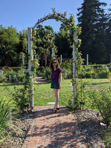 Gina Marinello-Sweeney near rose arch