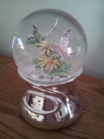 flower and butterfly snowglobe