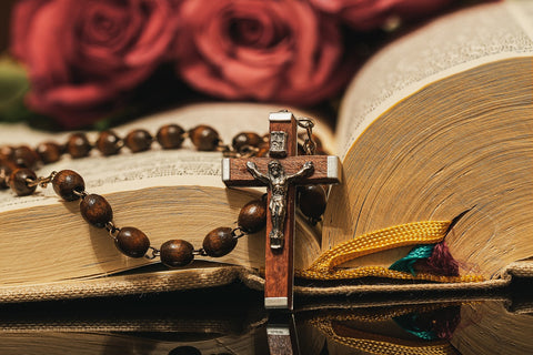 rosary, Bible, and roses