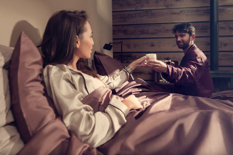 Couple in Bed drinking espresso