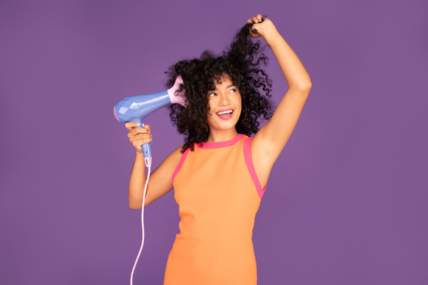 Woman using a diffuser with a Flower Dryer