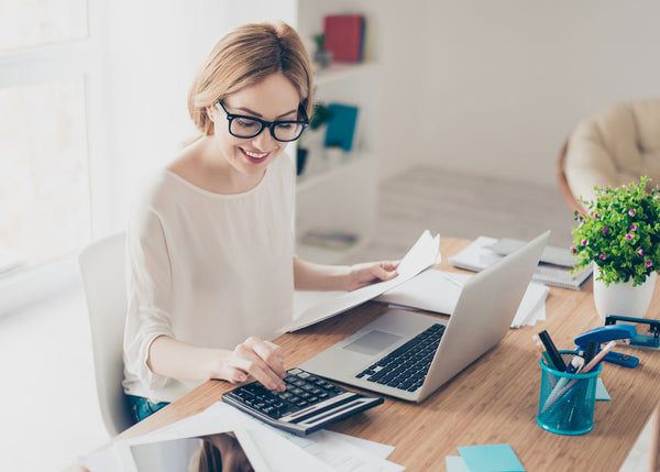 Woman working from a well designed home office.