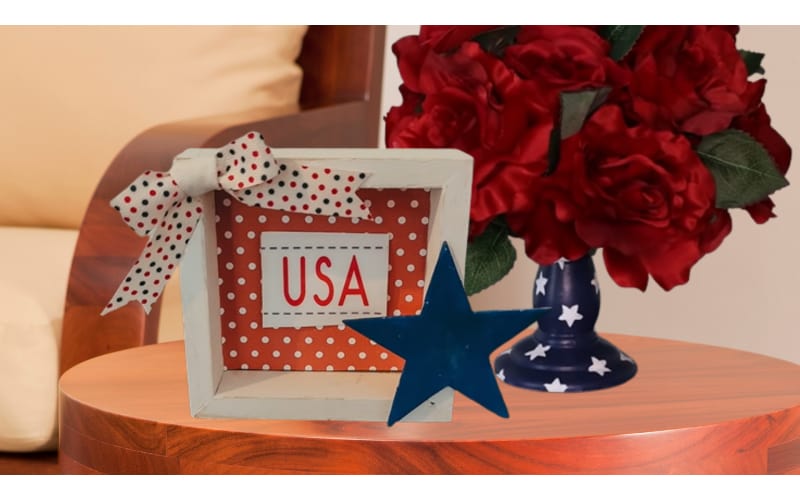 USA shadowbox and rose topiary on a wooden side table