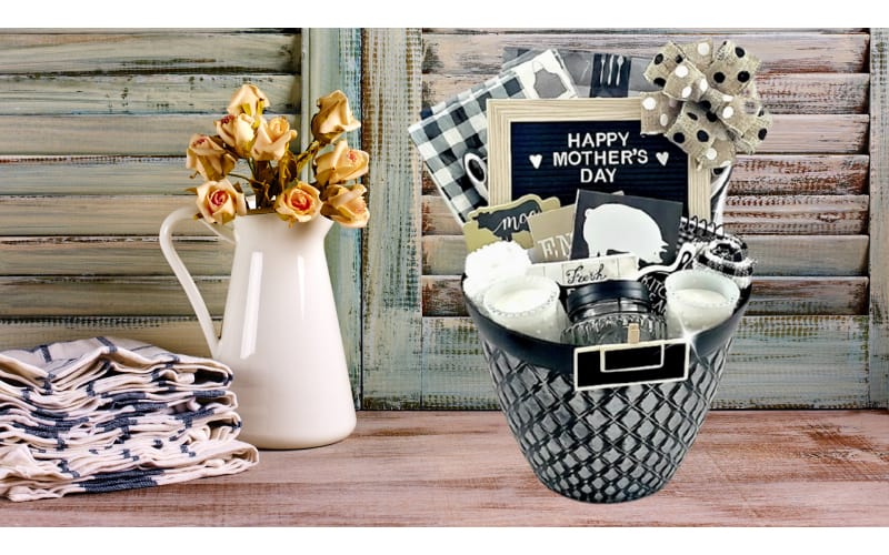 A farmhouse-themed gift basket filled with black and white gifts