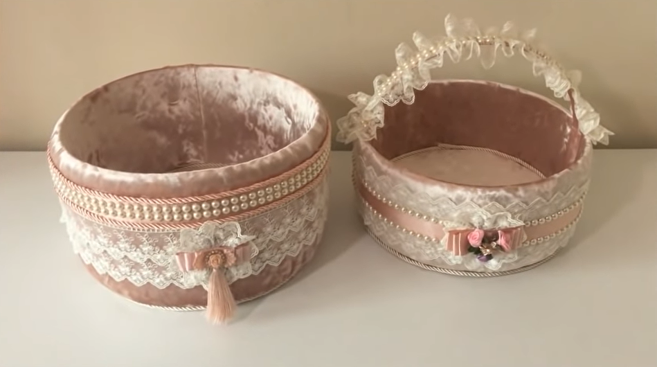 upcycled bucket or basin covered with velvet cloth, lace, and ribbons for a great gift basket idea