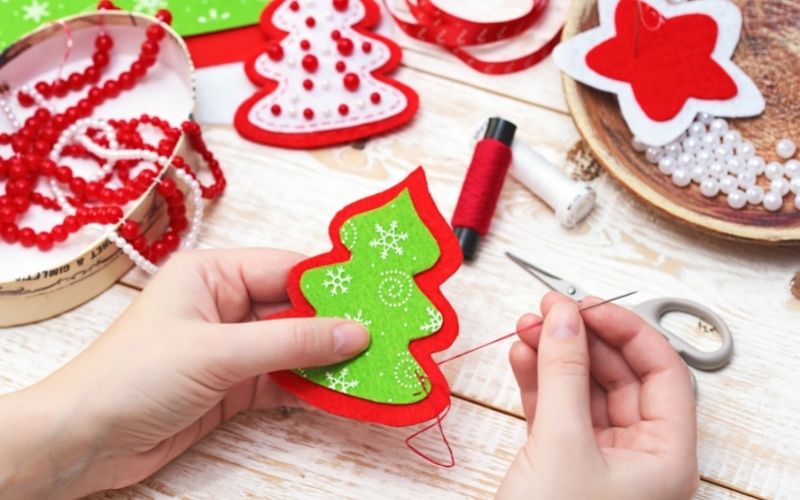 A Crafter Sewing a Felt Christmas Tree