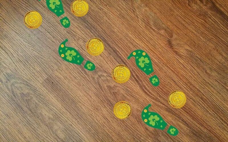 Chocolate trail and green footprints on the floor