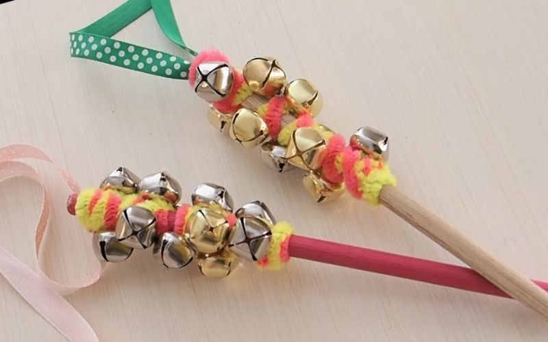 Jingle sticks made from dowel sticks and ribbons