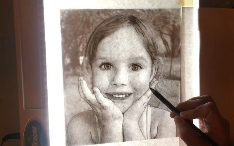 Tracing a portrait using a lightbox