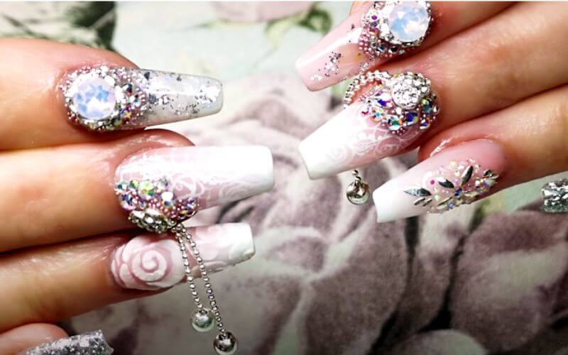 nails with white polish and lots of details