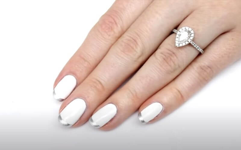 nails with white polish and silvertip