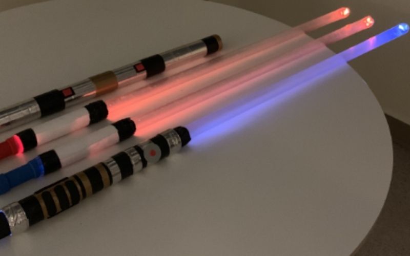 four pen lightsabers on the table