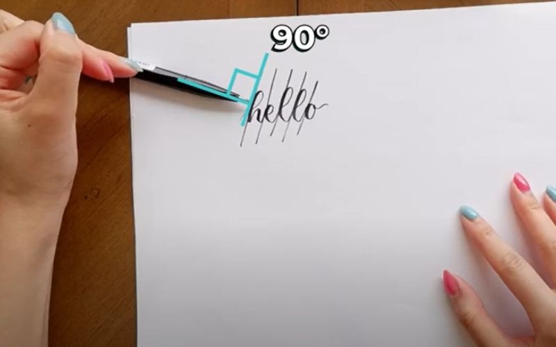 woman showing a 90-degree angle position in writing