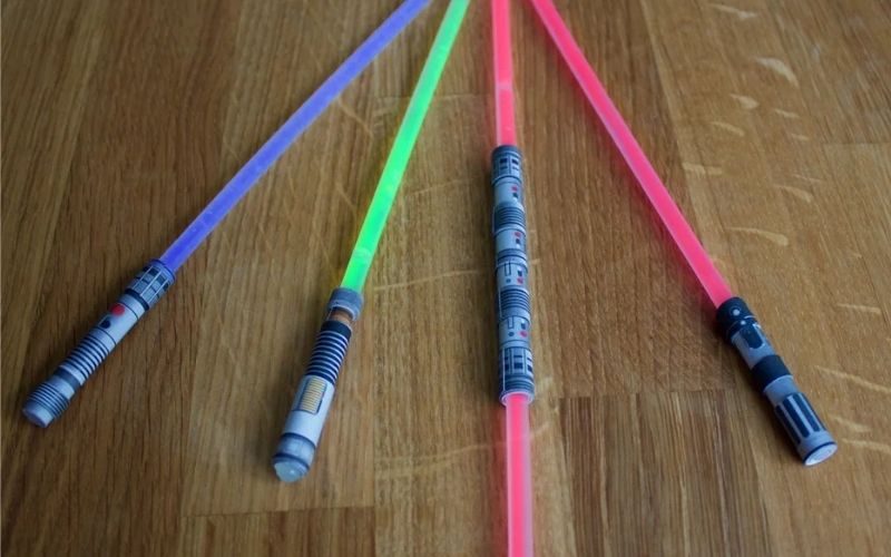 Four glow sticks lightsaber on the floor