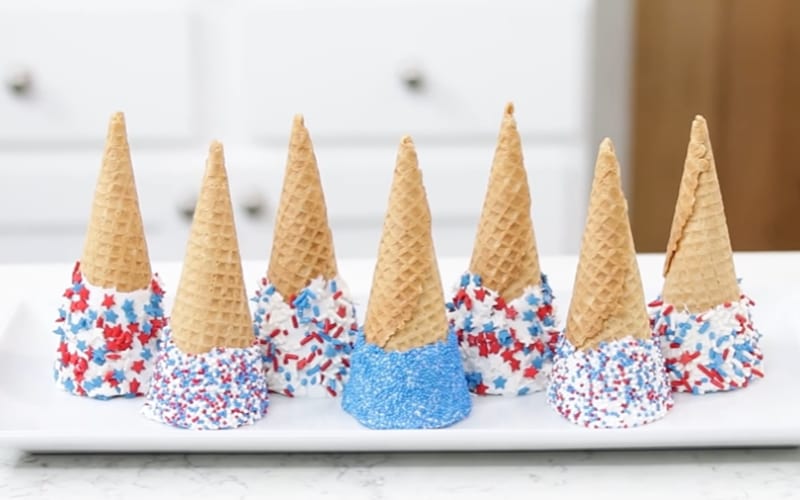  a tray full of decorated sugar wafer cones 