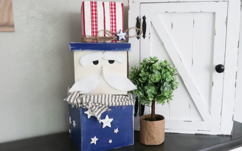 a trio of nesting boxes stacked to form an Uncle Sam decor