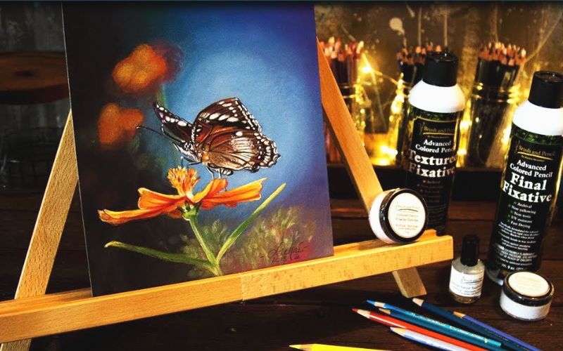 A painting of a butterfly on an easel with powder blenders and fixatives - Image by Lachri Fine Art