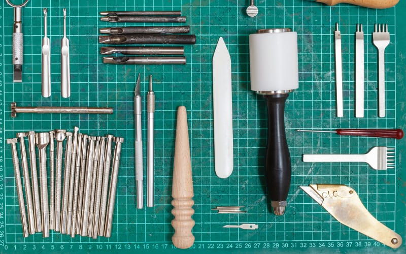  leather crafting tools on a self-healing mat