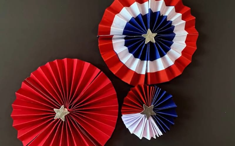 three accordion fold decors made from red, white, and blue cardstock