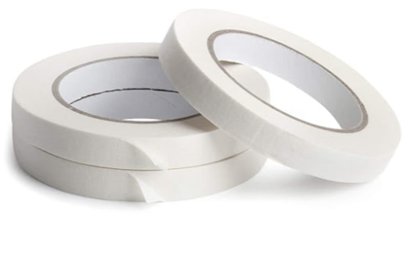 three rolls of white drafting tape