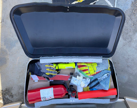 Airboard with tools, gloves, fire extinguisher and towels.