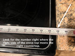 How to measure a Noodle Board, stove top cover? This picture shows the tape measure pulled to the right side of the stove top.