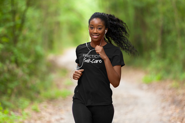a woman jogging wearing a Practicing Self-Care t-shirt