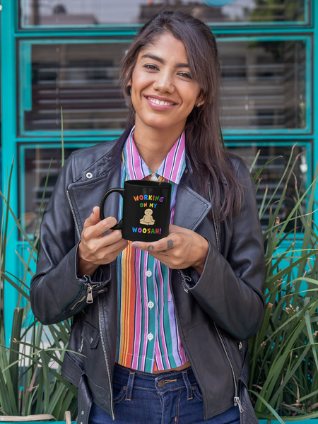 woman holding a working on my woosah mug