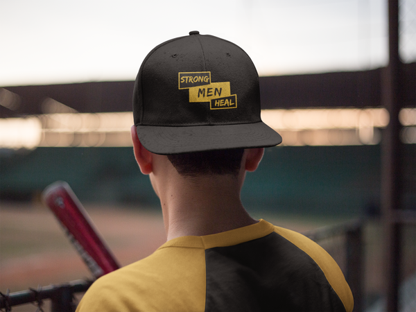 young man wearing a Strong Men Heal baseball cap
