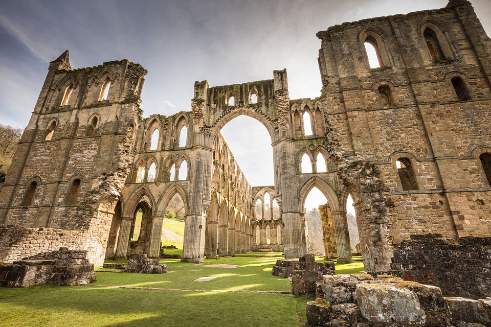 Sun shining through the remains of Rievaulx Abbey in Yorkshire