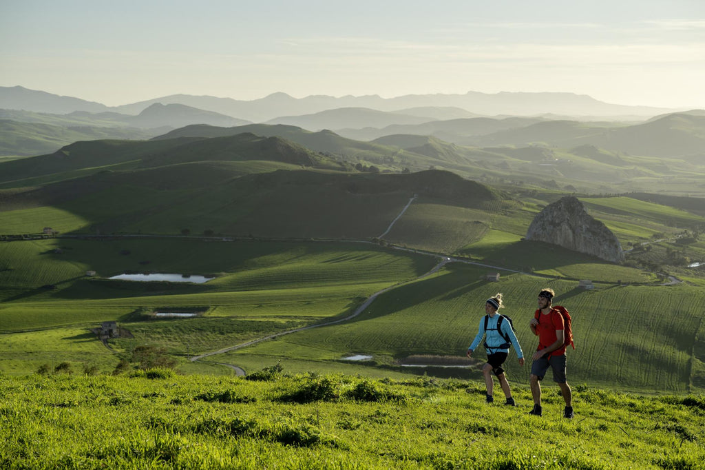 People walking up a hill with LOWA footwear