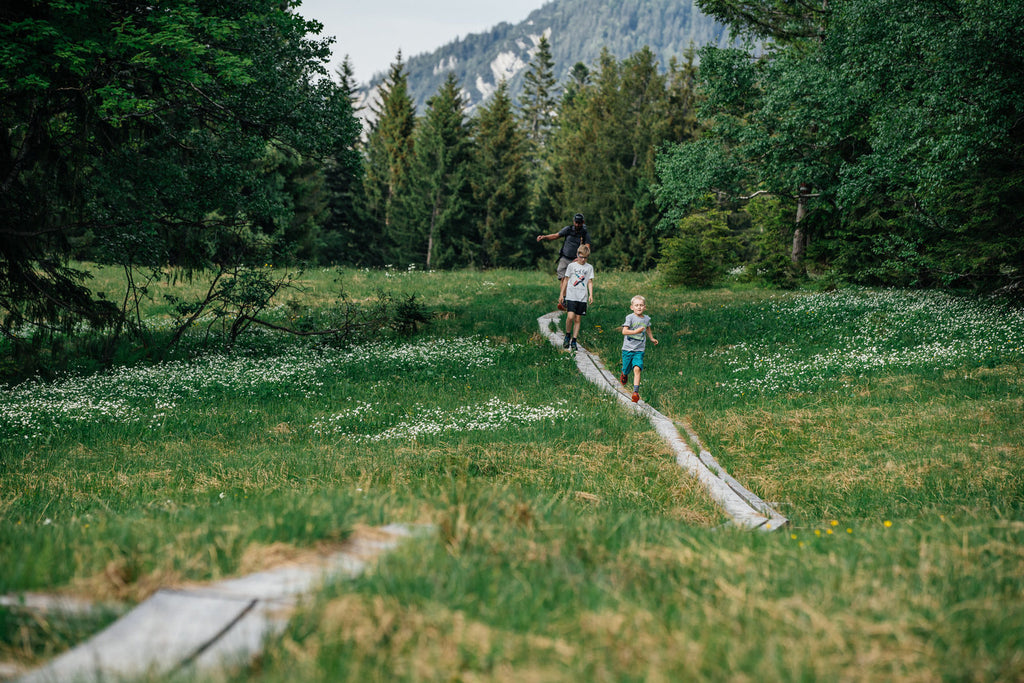 Children running along a trail