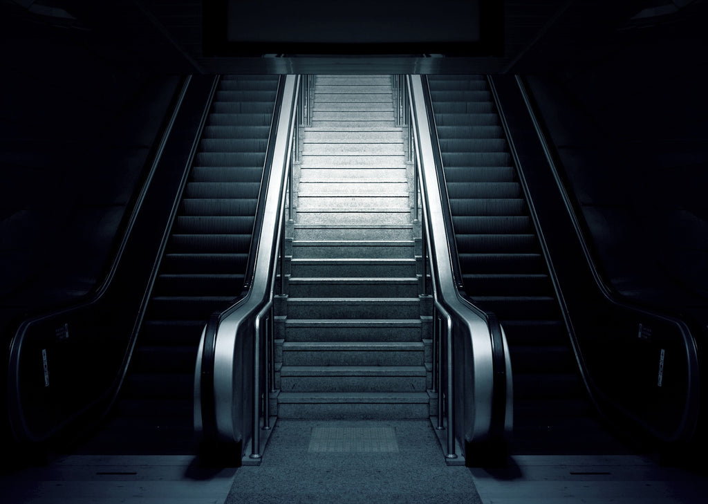 Stairs in-between escalator 