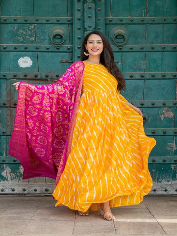 Yellow Silk Tie Dye Leheriya Gown with Dupatta (Set of 2) by Chokhi Bandhani now available at Trendroots