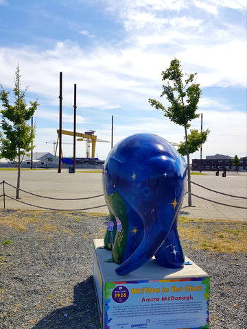 Elmer the 'Written in the Stars' Elephant sculpture, designed by Northern Irish visual artist Amira McDonagh, sits on the Titanic Slipway, overlooked by the famous Harland and Wolff shipyard Cranes.