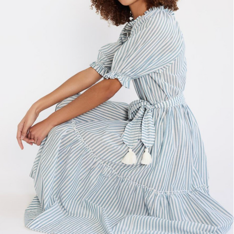 Model in Mille Zoe Dress shown in Calais Stripe, white with blue striping and tassel tie belt