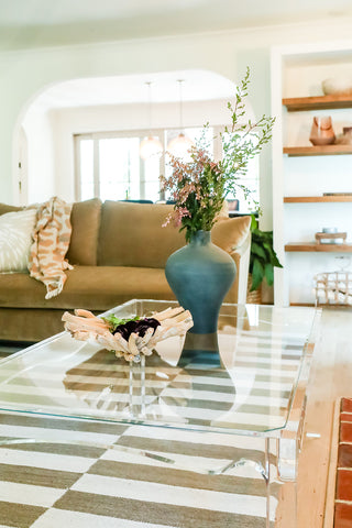 fresh flowers decorate this coffee table to welcome spring