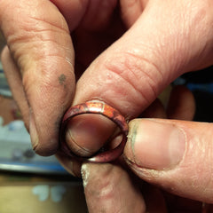 copper ring being made by hand