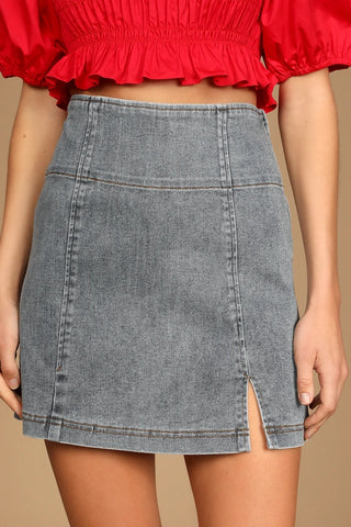 A mockup photo of a women wearing a light wash  Denim Mini Skirt from lulus.com 