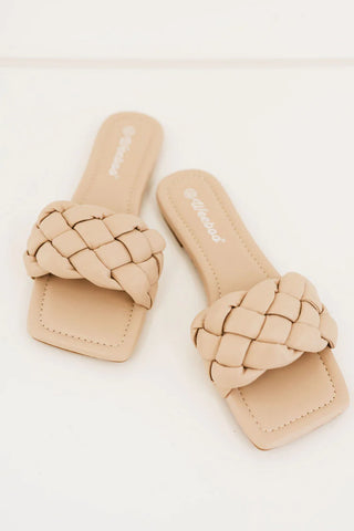 A mockup photo of our nude Weeboo Cakewalk Woven Square Toe Slides from yorkdante.com, an online boutique for women