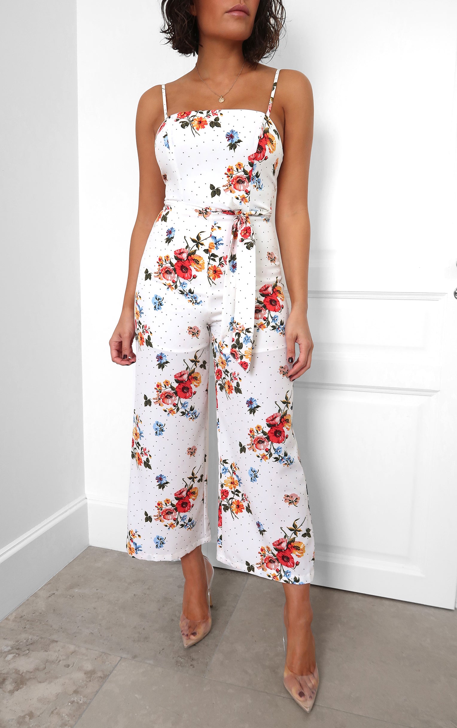 white jumpsuit with flowers