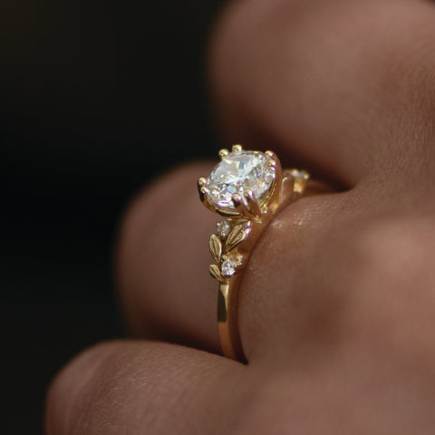 Nature inspired solitaire diamond engagement ring made in 14k gold.