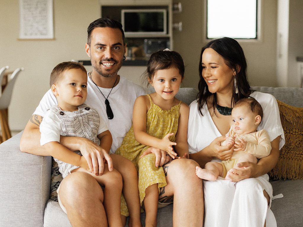 Tamihana family sitting on couch