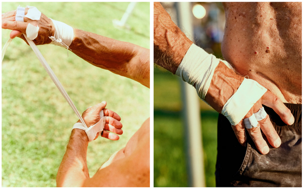 Mr. Moore wrapped his hands in tape to reduce blistering during trapeze practice.