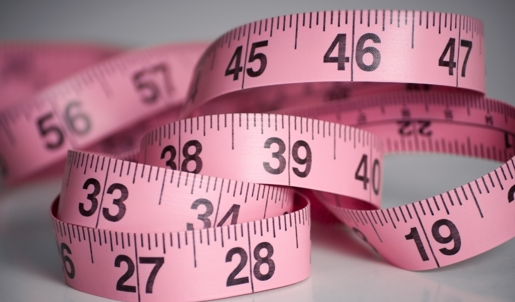 Pink measuring tape for determining hat size